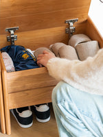 solid wood shoe cabinet used as entryway storage for bags and keys