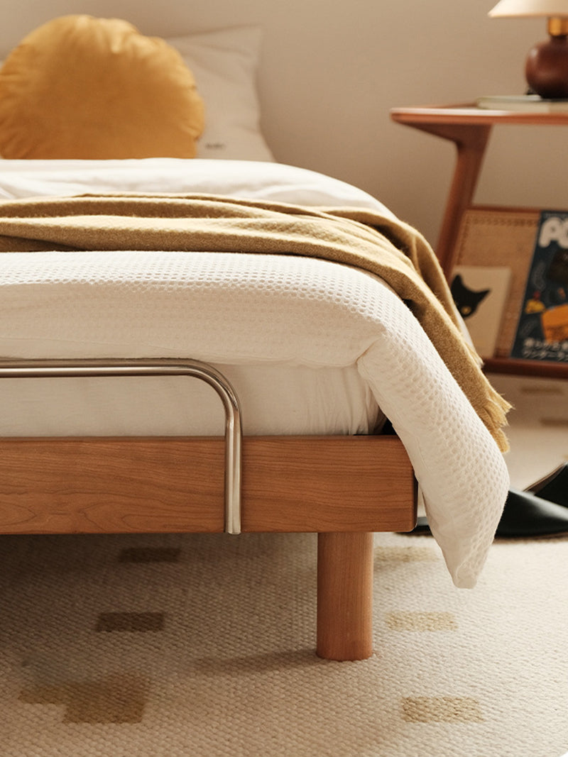 scandinavian style wooden bed in bright bedroom